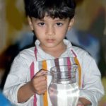 child with jug